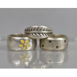 Three Silver Rings to Comprise Two Heavy Bands the One with Daisy Decoration and the Other Spots