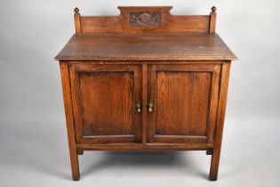 An Early 20th Oak Washstand with a Carved Gallery Back, Panelled Cupboard Base on Square Supports,