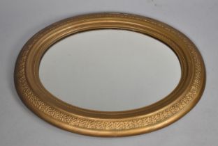 A Mid 20th Century Gilt Framed Oval Wall Mirror, 77x64cms Overall