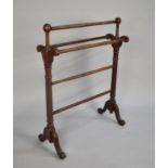 An Edwardian Mahogany Towel Rail with Reeded Supports, 67cms Wide