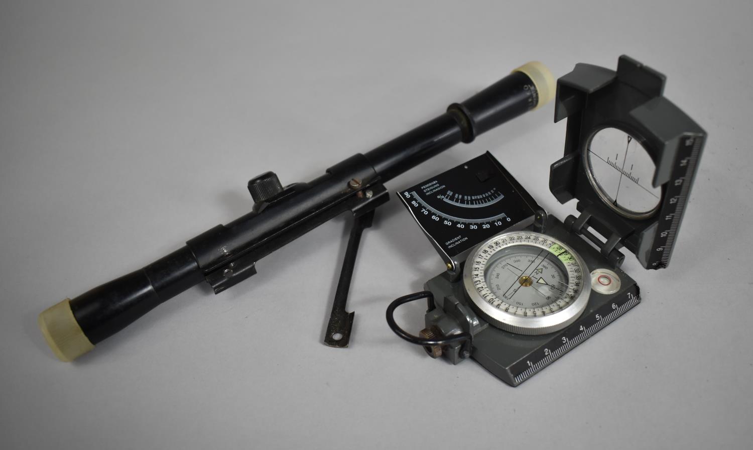 A Konustar Compass Together with a Nikko Mountie 4x18 Riflescope