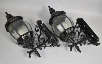 A Pair of Black Painted Aluminium Wall Lights in the form of Cast Iron Victorian Lanterns