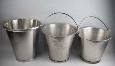 A Collection of Three Graduated Stainless Steel Measuring Buckets, Largest 33cms Diameter and