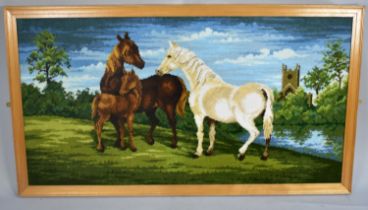 A Large Framed Tapestry Depicting Horses in Meadow Before Church, 130x68cms