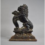 A 19th Century Cast Iron Door Porter in the Form of Lion Rampant, 38cms High