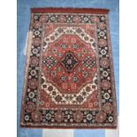 A Rectangular Patterned Hearth Rug, 94x136cms