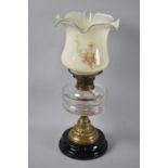 A Late Victorian Oil Lamp with Ribbed Glass Reservoir, Brass Supports with Later Floral Decorated