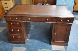 An Edwardian Kneehole Partners Desk with inset Leather Writing Surface, Three Top Drawers over Two