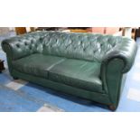 A Large Two Seater Green Leather Effect Button Back Chesterfield Settee