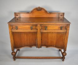 An Edwardian Oak Galleried Sideboard with Two Drawers over Cupboard Base, 122cms Wide