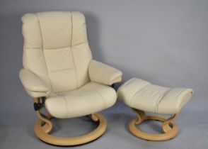 A Modern Ekornes Leather Upholstered Swivel Reclining Armchair with Matching Footstool