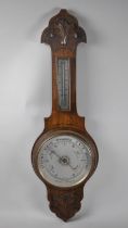 An Late Victorian/Edwardian Onion Top Carved Oak Aneroid Barometer