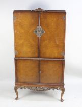 A Mid 20th Century Walnut Cocktail Cabinet the Mirrored Top Section with Two Glass Shelves,