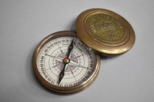 A Circular Brass Compass, the Screw Off Lid Inscribed 'Makers to the Queen 1953', Inner Lid Engraved
