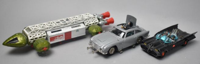 An Unboxed Corgi Toys Batmobile and Aston Martin DB5 together with a Dinky Toys Eagle