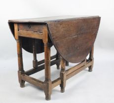 An Early 19th Century Oak Drop Leaf Gate Leg Table, 106cm wide and 135 Diameter Top When Open