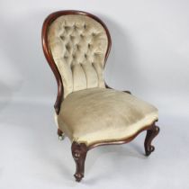 A Late 19th Century Mahogany Framed Balloon Backed Nursing Chair with Buttoned Upholstery