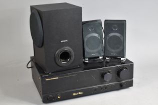 A Marantz Stereo Amplifier Together with Three Creative Speakers