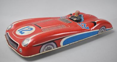 A Vintage Tin Plate West German Toy Racing Car