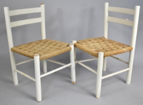A Pair of Vintage White Painted Rush Seated Children's Bar Back Chairs