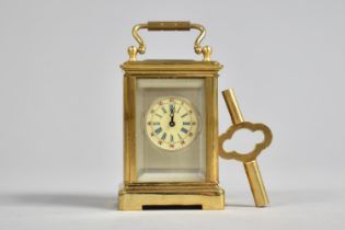 A Miniature Brass Cased Carriage Clock with Silver Plated Front Panel and White Enamelled Dial, 7.