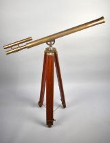 A Reproduction Brass Telescope on Brass Mounted Wooden Tripod, 96cms Long