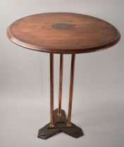 A Copper Brass and Iron Based Tripod Table with Circular Wooden Top having Printed Starburst