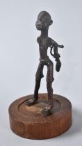 A Vintage African Benin Bronze Figure Depicting Slave with Hands Tied Behind Back, Circular Wooden