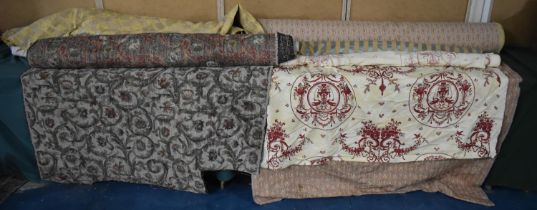 A Collection of Various Rolls of Fabric Etc