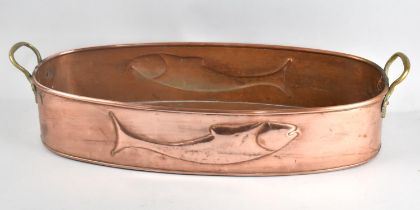 A Large Copper Fish Kettle with Brass Handles Decorated in Relief to both Sides with Salmon, 65cms