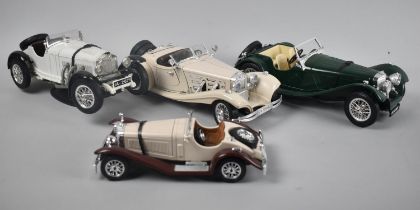 A Collection of Four Unboxed Burago Diecast Sports Cars