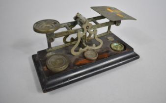 A Set of Edwardian Postage Scales on Stained Wooden Plinth Base having Three Unrelated Weights,