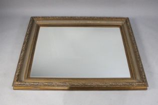 A Large Gilt Framed Wall Mirror with Bevelled Glass, 127x103cms