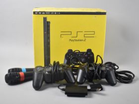 A Vintage Playstation 2 with Two Controllers and Collection of Various Games