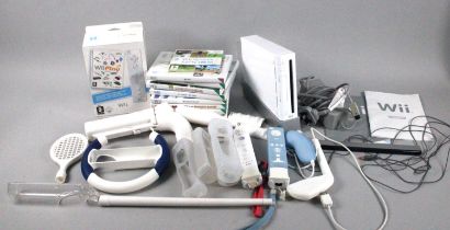 A Collection of Various Wii Gaming Consoles, Balance Board, Controllers, Accessories and Games Etc