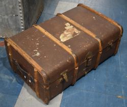 A Vintage Wooden Bound Travelling Trunk with Remnants of Luggage Labels, 75cms Wide