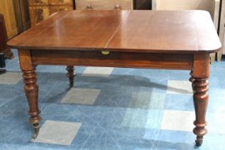 A Late 19th Century Mahogany Pull Out Extending Dining table with Two Leaves, 230cms by 104cms