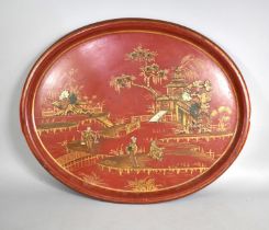 A Large Papier Mache Chinoiserie Tray decorated with Figures, Pagoda etc, 75cms by 20cms