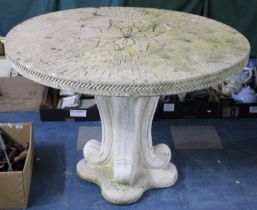 A Large and Heavy Reconstituted Stone Patio Table with Circular Top on Scrolled Quadrant Supports,