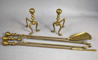 A Set of Three Brass Long Handled Fire Irons and a Pair of Brass Dogs, 23cms High