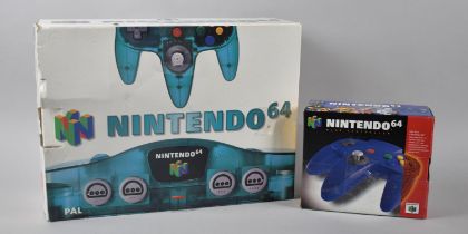 A Vintage Nintendo 64 Gaming Console, Crystal Turquoise with One Controller together with an N64