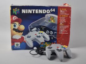 A Vintage Nintendo 64 with two Controllers, Golden Eye and Super Mario Games