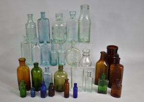 A Collection of Various Chemists and Other Glass Bottles