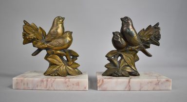 A Pair of French Clock Garnitures in Gilded Metal on Marble Bases in the Form of Bullfinches, 13.