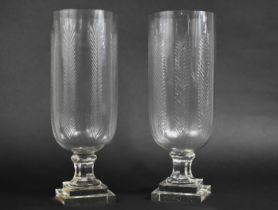 A Pair of Tall Glass Hurricane Lamps, 44cms High