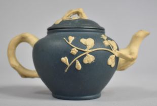 A Chinese Yixing Blue Ground Teapot with Cream Stylised Handle and Spout, 8cms High