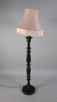 A Vintage Turned Wooden Standard Lamp with Shade