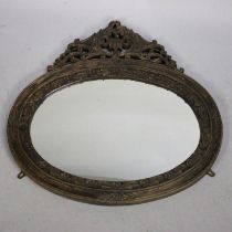 A Carved Wooden Oval Framed Wall Mirror, 73cm Wide