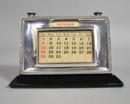 A Silver Mounted Desktop Calendar by W J Myatt & Co, Birmingham Hallmark 1952, 15x10cm high