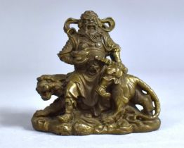 A Heavy Bronze Study of a Chinese Warrior God, Guan Yu, Sat on a Snarling Tiger, 8.5cm Long